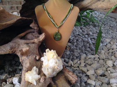 17. Multi-Stranded Mother-of-Pearl and Jade with Serpentine Oval $59.95 17. Multi-Stranded Mother-of-Pearl and Jade with Serpentine